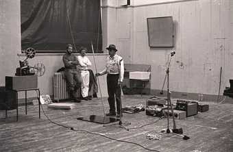 Fig.9 Beuys performing Celtic (Kinloch Rannoch) Scottish Symphony, with Christiansen behind (right), for the exhibition Strategy: Get Arts at the Edinburgh College of Art, 23–30 August 1970