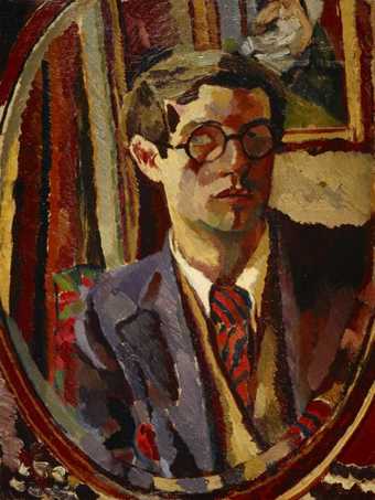 A portrait of a figure wearing glasses, a suit and a tie, set in an oval shape and with a painting hanging in the background
