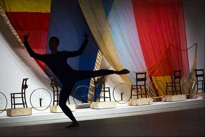 Robert Rauschenberg’s set design Tantric Geography for Merce Cunningham’s Travelogue 1977, with a dancer performing a piece by Cunningham
