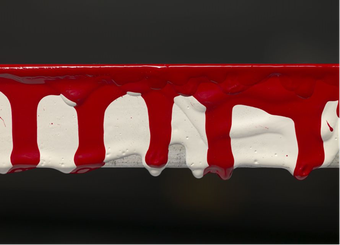 A horizontal view of part of the panel edge of Red Barn Door with five long red drip marks coming downwards, white drip marks seen underneath them, and shorter red drips seen over the top.