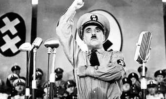 Charlie Chaplin as Hitler in The Great Dictator (1940) (film still)