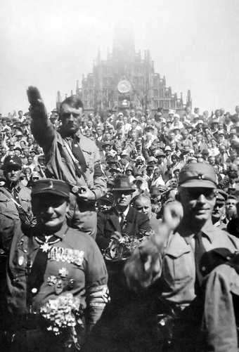 Heinrich Hoffman Nazis giving the Sieg Heil salute at a Nazi Party rally in Nuremberg, 1928