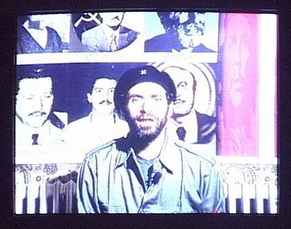 Installation view of the monitor in Three Posters 2000 showing Rabih Mroué as Khaled Rahhal