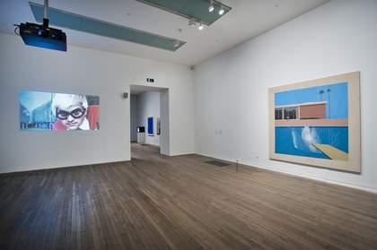 Fig 3 Installation view of David Hockney’s A Bigger Splash 1967 (right) with Jack Hazan’s film, A Bigger Splash 1973 (left) in the exhibition A Bigger Splash 2012