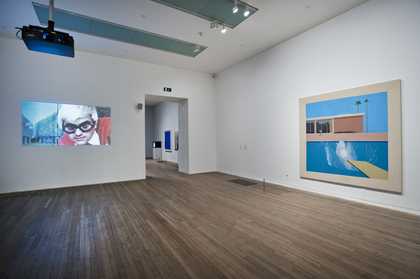 Fig 3 Installation view of David Hockney’s A Bigger Splash 1967 (right) with Jack Hazan’s film, A Bigger Splash 1973 (left) in the exhibition A Bigger Splash 2012
