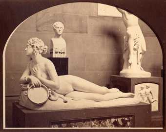 Photograph showing the arrangement of works in the north bay of the west wall of the Sculpture Gallery, Chatsworth House, 1858
