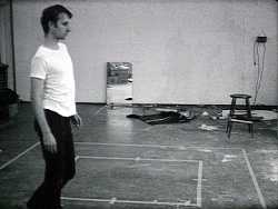 Bruce Nauman, Walking in an Exaggerated Manner Around the Perimeter of a Square 1967–8 (film still)