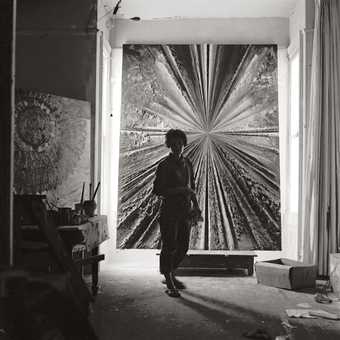 Jay DeFeo standing in front of The Rose at 2322 Fillmore Street, 1959