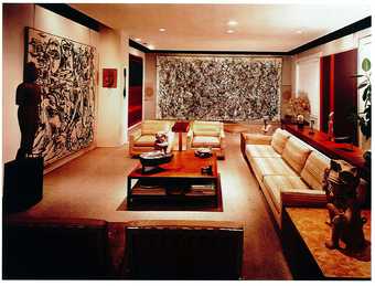 Photograph of the Hellers’ lounge taken in 1960, showing (from left to right) Pollock, Echo: Number 25 1951; Rothko, Four Darks in Red 1958; Pollock, One: Number 31 1950; and Newman’s Adam