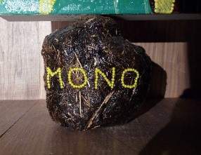 Chris Ofili, Detail of Mono Amarillo (Yellow Monkey) from The Upper Room, showing one of the dung ball supports bearing the title of the painting