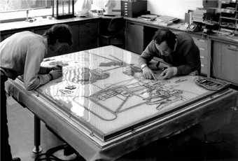 Photograph of Tate conservators Christopher Holden and Roy Perry working on the shattered lower panel of The Large Glass
