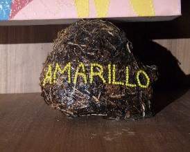 Chris Ofili, Detail of Mono Amarillo (Yellow Monkey) from The Upper Room, showing one of the dung ball supports bearing the title of the painting