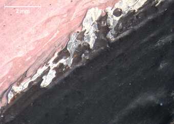 Micrograph of the lower border of the breast seen in profile, central figure, showing the grey ground where the black, pink and white colours met wet-in-wet to create a marbled effect