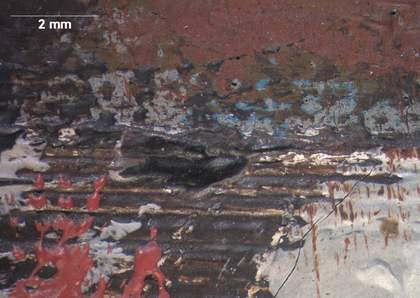 Micrograph of the border of the floor and the panel on the right side, showing the grey priming not fully covered