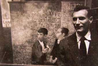 Bernard Perlin in front of Orthodox Boys 1948 at the opening of his first one-man show at M. Knoedler & Co., New York, 1948