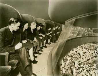 Fig.3 Norman Bel Geddes, General Motors – Futurama – Visitors in Moving Chairs Viewing Exhibit 1935–45