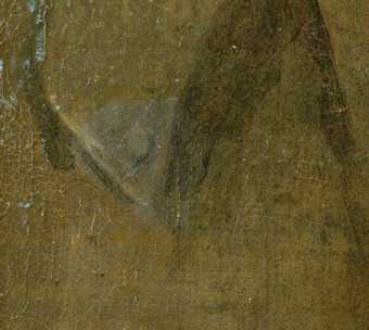 A triangle of lighter paint on a darker surface where the varnish has been removed from the painting