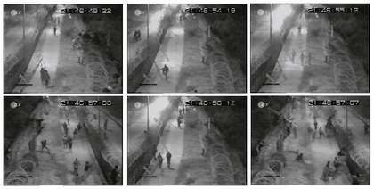 Stills from Florian Schneiders Ceuta 2006 cctv footage of migrants climbing the ceuta border fence