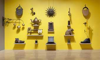 Items hanging on the wall for British Folk Art exhibition at Tate Britain