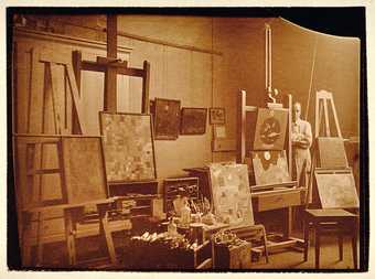 Paul Klee in his studio at Weimar Bauhaus, photographed by Felix Klee, 1925