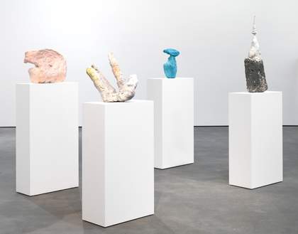 Sculptures places on top of book shelves