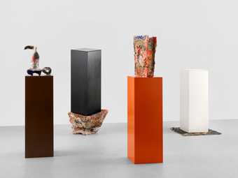 Abstract sculptures on plinths and plinths standing on top of abstract sculptures