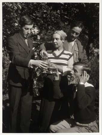 Frederick Ashton, Lydia Lopokova, Duncan Grant and Billy Chappell drinking a toast in the garden at Charleston © Tate