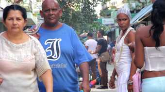 Film still of people in the streets of Havana
