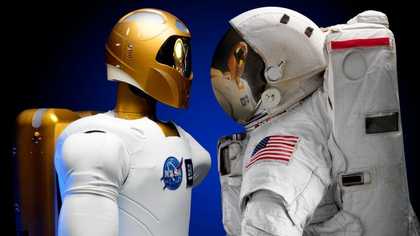 Photograph of two astronauts looking at each other