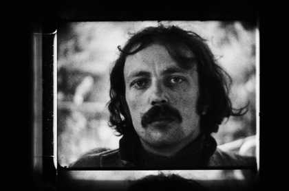 Black and white photograph of the artist Franz West