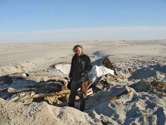 Gabriel Orozco with whale skeleton Isla Arena Baja California 2006 photograph of the artist with a partially exposed whale skeleton in the desert