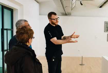 Visitor Assistant talking to visitors