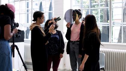 People using cameras in the middle of a shoot