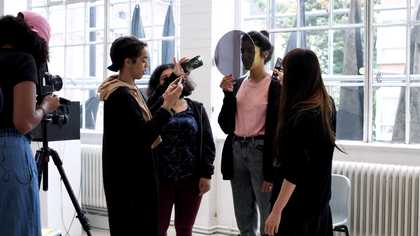 People using cameras in the middle of a shoot