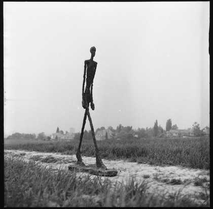 Giacometti's Walking Man I, 1960 photographed by Ernst Scheidegger in the Swiss countryside, 1963