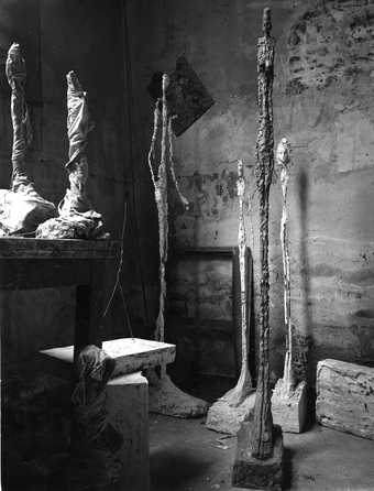 Standing Woman, 1948 and other sculptures in Giacometti's Paris studio, c. 1948-9, photographed by Ernst Scheidegger
