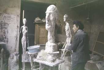 Giacometti in his Paris studio working on a project for Chase Manhattan Plaza in 1958, photographed by Ernst Scheidegger