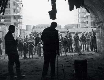 Gilbert and George performing Singing Sculpture, Cable Street, London, 1969