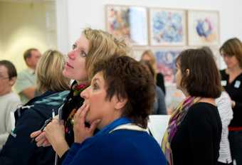 A group of visitors in a gallery space at Tate St Ives