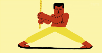 A man does the splits holding onto a rope. He has dipped his feet in black paint and has painted a line between his feet.