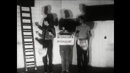 Film still of three people standing