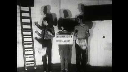 Film still of three people standing