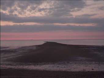 Neil Henderson Three Studies in Geography 2011 video still showing a landscape at dusk