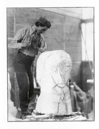 Henri Gaudier Brzeska carving Hieratic Head of Ezra Pound c1914 photograph of a man carving a peice of white marble