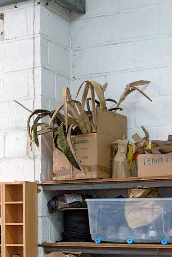 Interior shot featuring boxes of materials in Hew Locke's studio