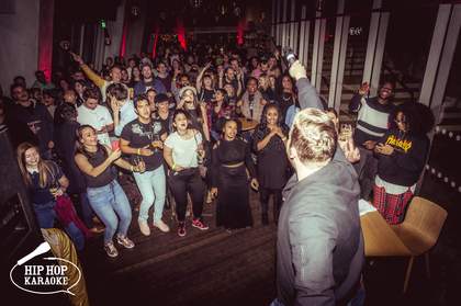 A bunch of young people having fun at a hip hop event