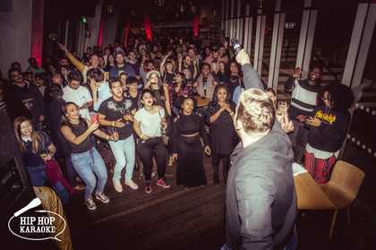A bunch of young people having fun at a hip hop event