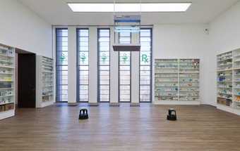 Installation view of Damien Hirst's Pharmacy at Tate Modern, 2012