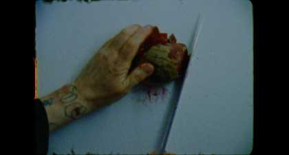 Film still close of of a person's hand