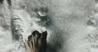 Film still of a foot in the snow